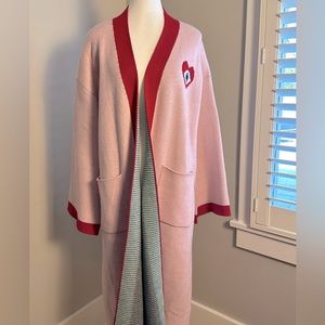 Soft pink sweater jacket with modern eye graphic. Size S/M (runs large).
